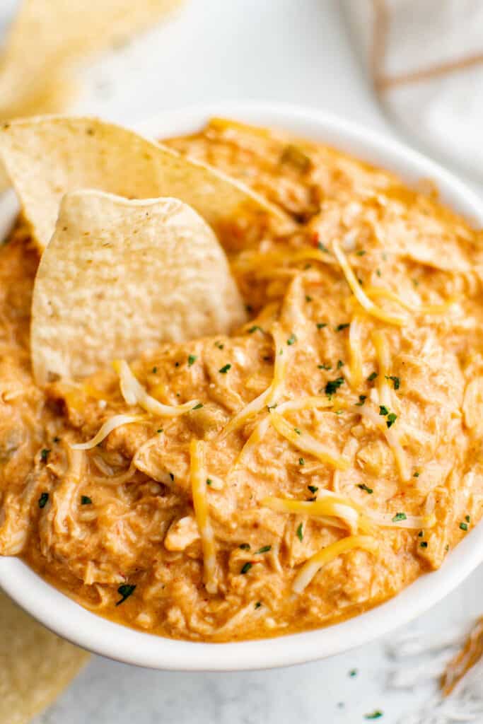 shredded crockpot queso chicken in a bowl