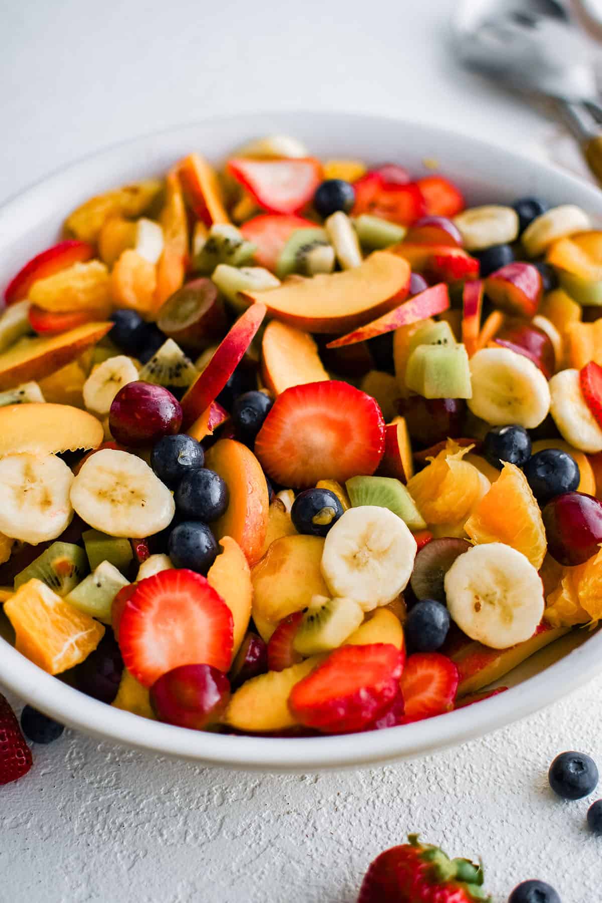 summer fruit salad in a white bowl