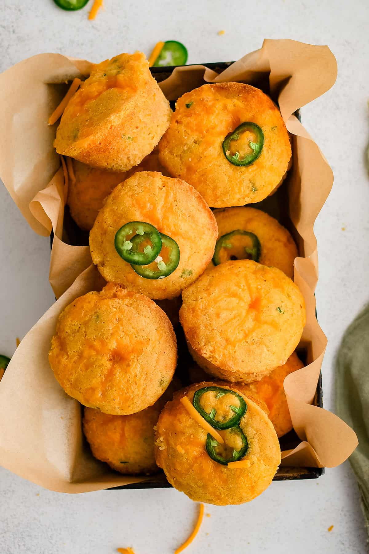 jalapeno cheddar corn muffins in a tin