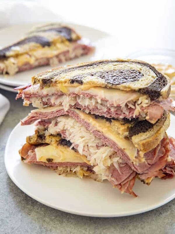 stacked reuben sandwich on a plate